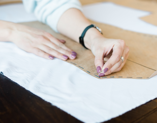 A person using a sewing pattern