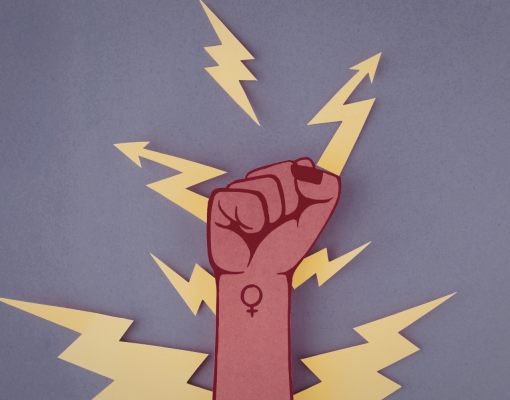 A fist with the female icon written on it