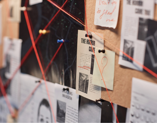 Pin board with crime solving material