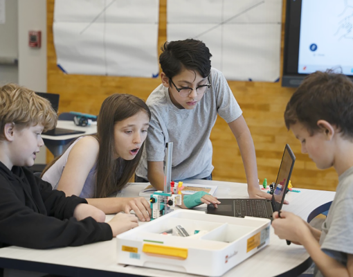 students working on coding lego project
