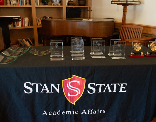 Table with faculty awards on display
