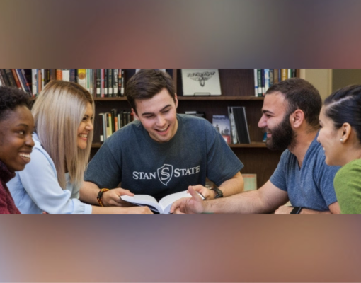 A group of five students sit at Learning Commons-Spring Into Study event