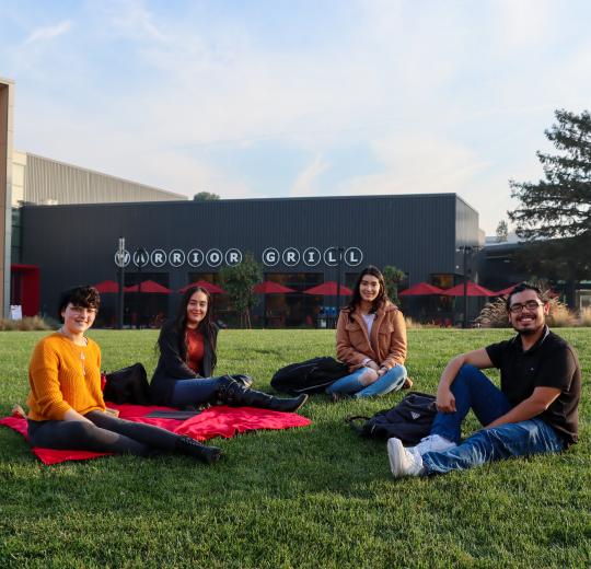four students in group photo.