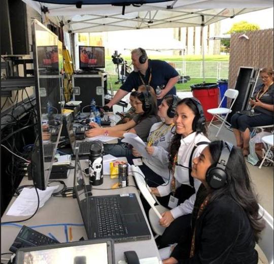 backstage at commencement, equipement students and staff