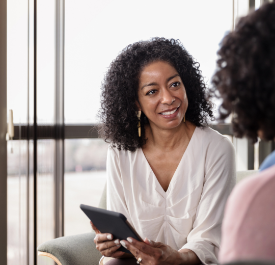 Image of a counselor speaking to a patient.