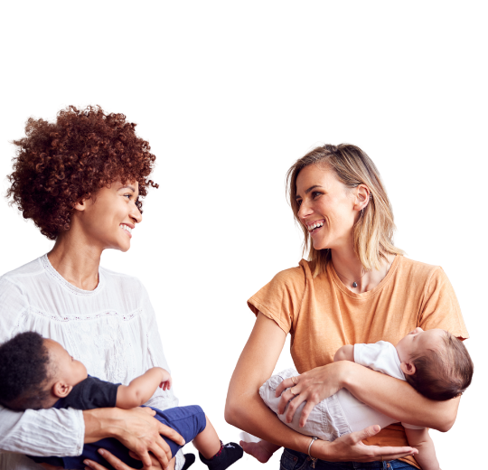 Image of two women each holding a baby talking to each other