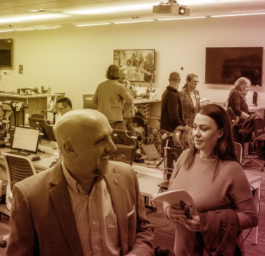 Photo of a group of 7 people touring the fab lab