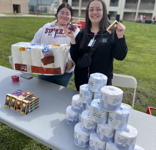 students in housing passing out toilet paper