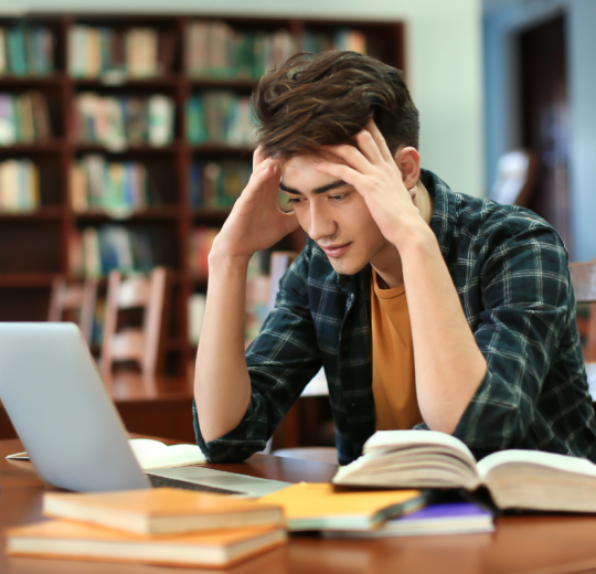 Student at a desk with computer