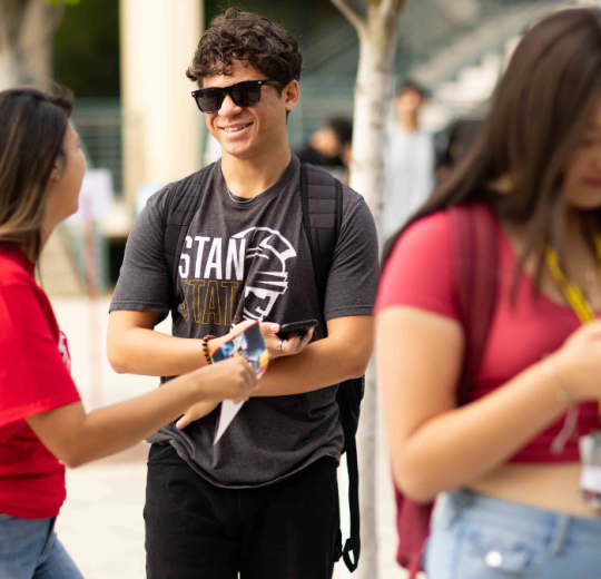Student with sunglasses socializing at NSAR
