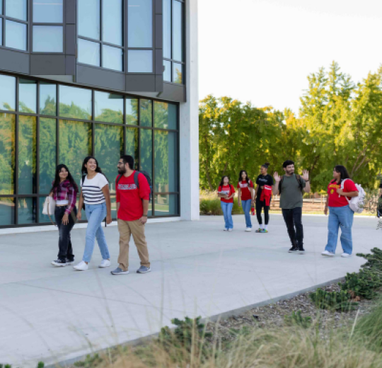 Students walking by the library