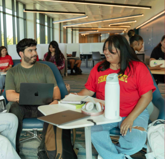 Students sitting on the second floor of the library