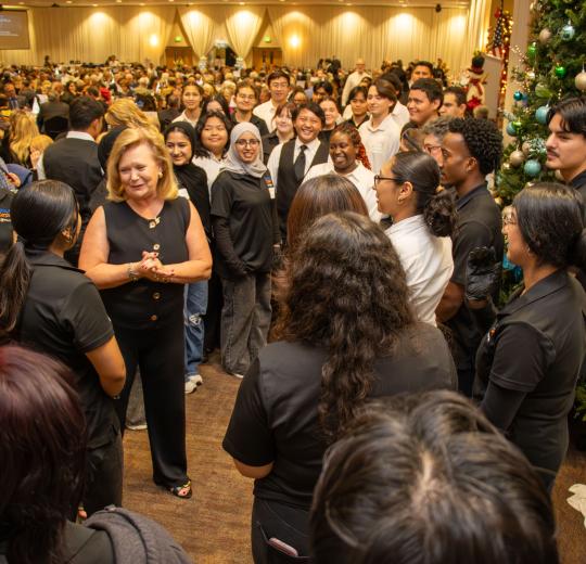 President Britt Rios-Ellis with student volunteers at Legacy of Hope.