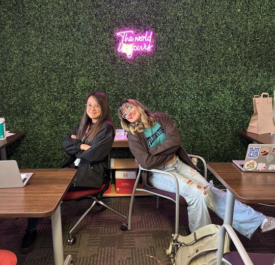 two PACs pose in the academic hub