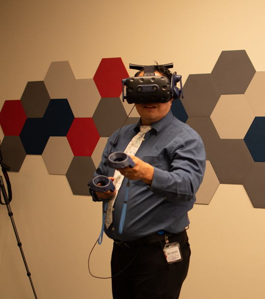 A person uses technology in the Warrior Fab Lab