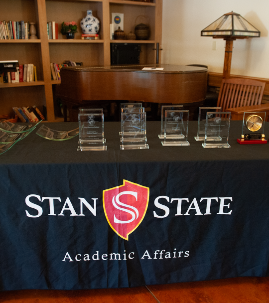 Table with faculty awards on display