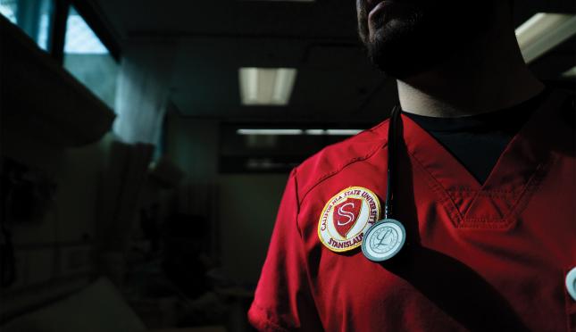 detail of University seal on nursing student scrub