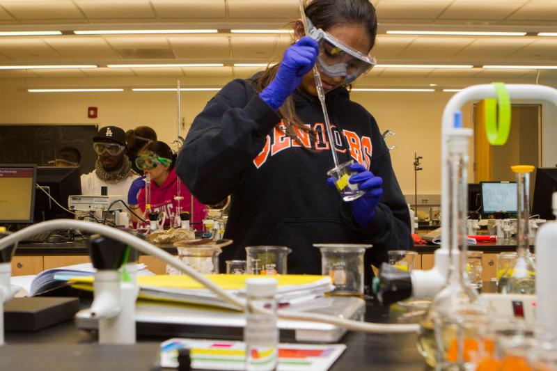 Diverse students work in chemistry lab