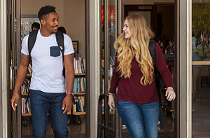 Students exit the campus library.